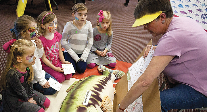 Cape Fear River Watch board member Melissa Juhan teaches children about anadromous fish in the Cape Fear River at StriperFest Education Day. Photo: Lumina News